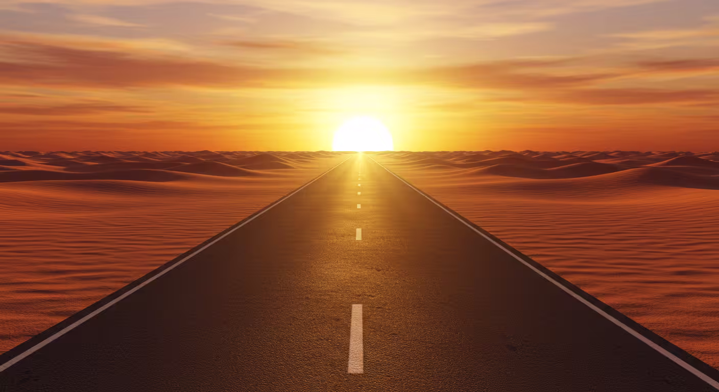 estrada no deserto iluminada pelo horizonte